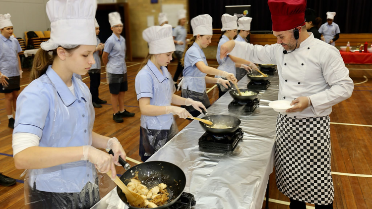 photo of students cooking food