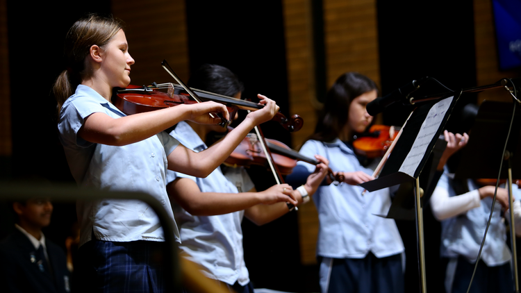 picture of students playing violin